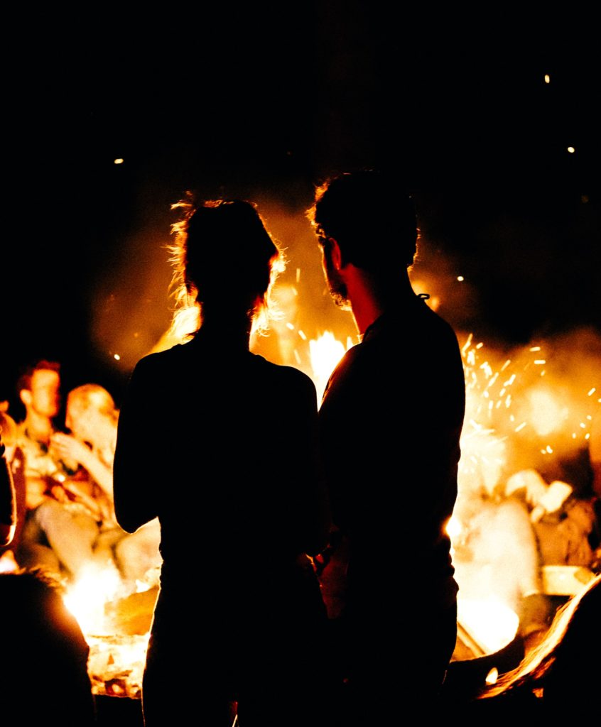 Warmth counteracts Stomach Cold Invasion: two persons standing in front of bonfire