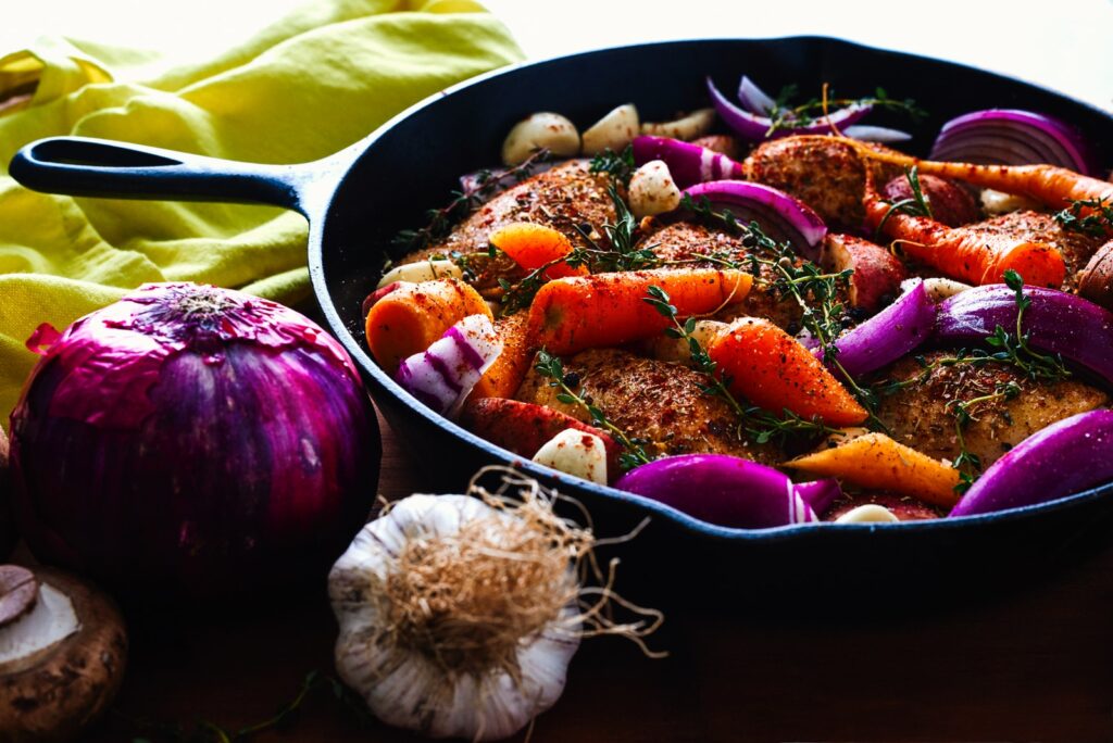 carrots, garlic, onions, and herb spicing meat on skillet: mostly good for Kidney Yang deficiency