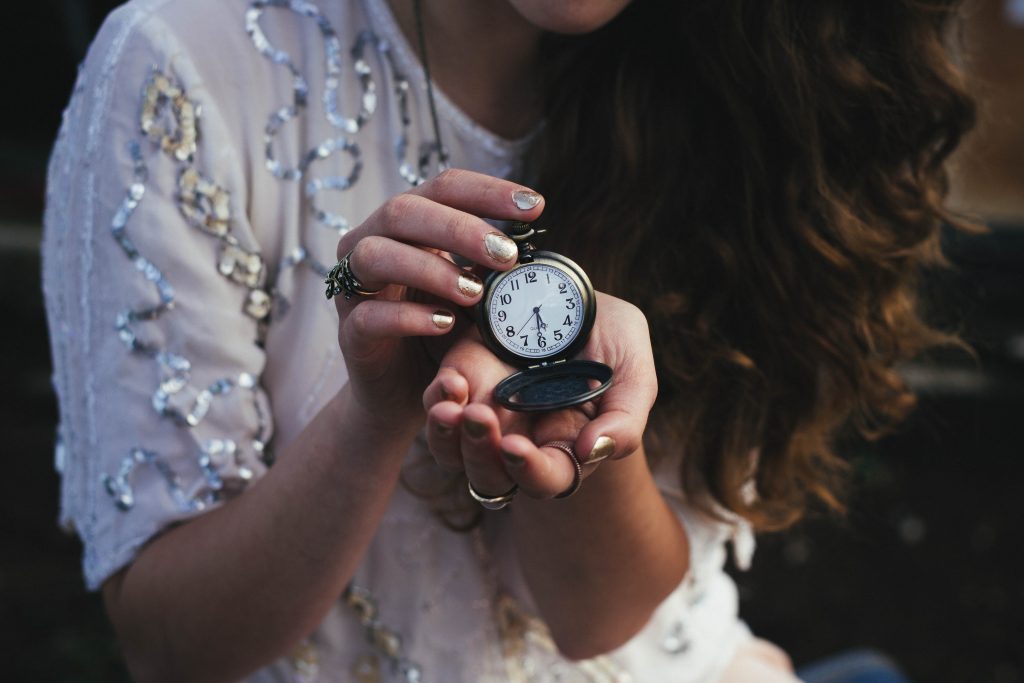 Woman holding a pocket watch