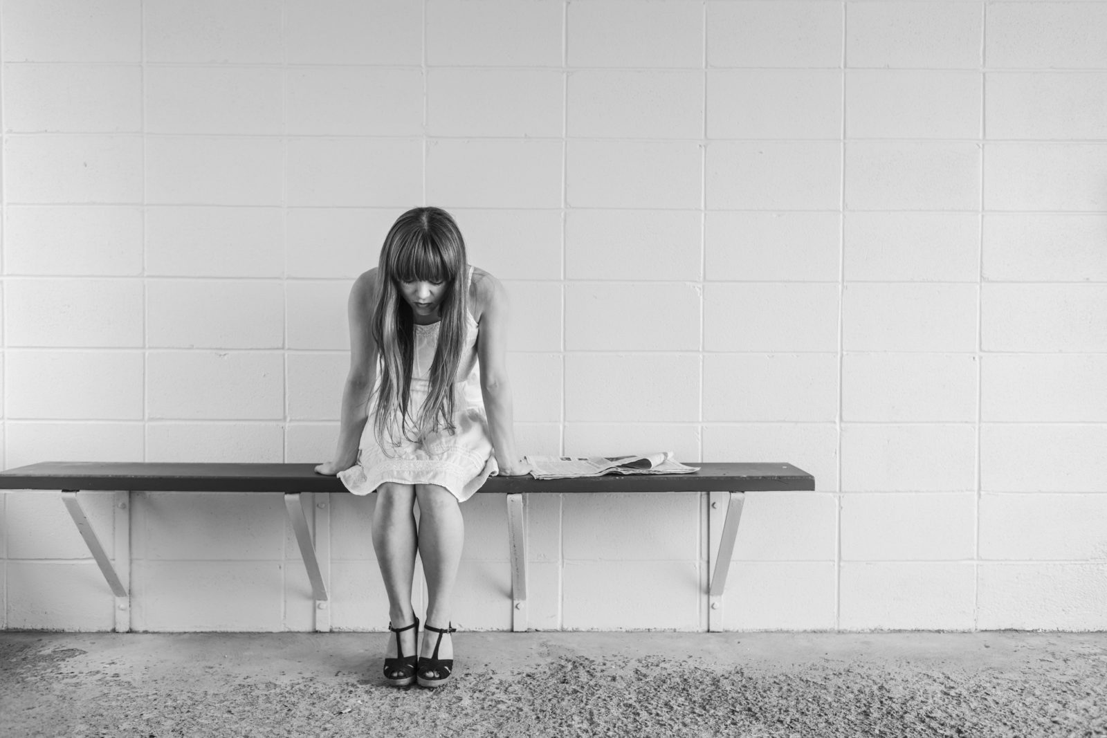 Anxious woman sitting on a bench