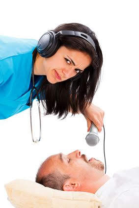 Doctor lady listening to a sleeping man's snoring - disturbing snoring concept.