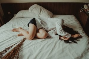 Woman tired on bed