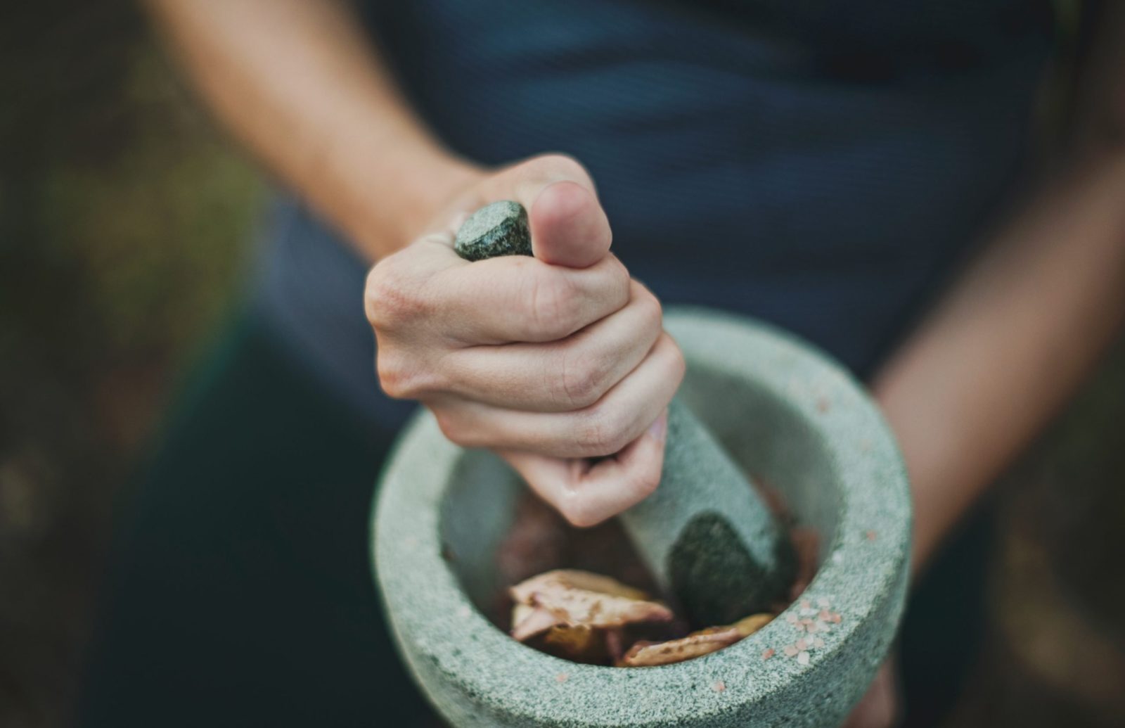 Grinding chinese herbs with mortar and pestle
