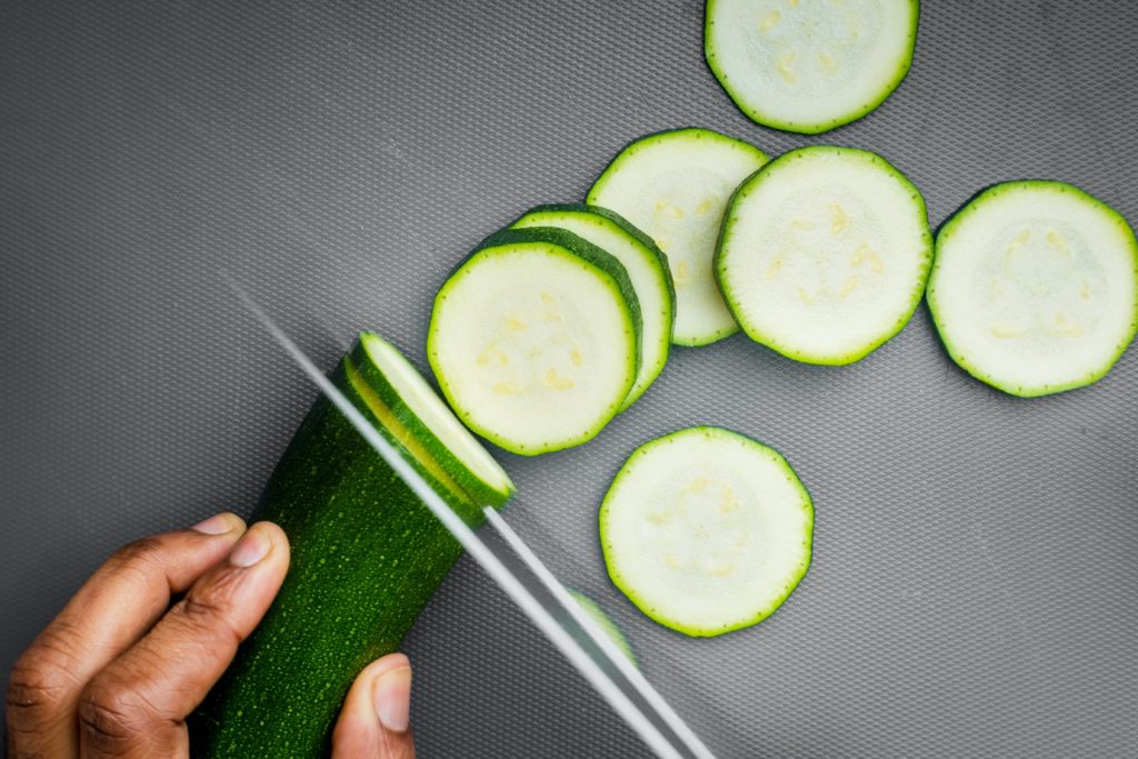 sliced cucumber on black textile: cucumber is a cooling food - it cools you.