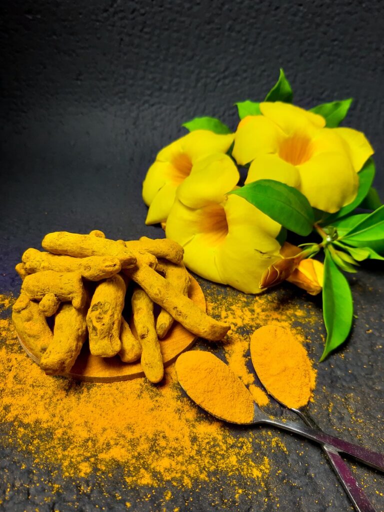 yellow flower on gray surface: a little turmeric helps some kinds of liver qi stagnation