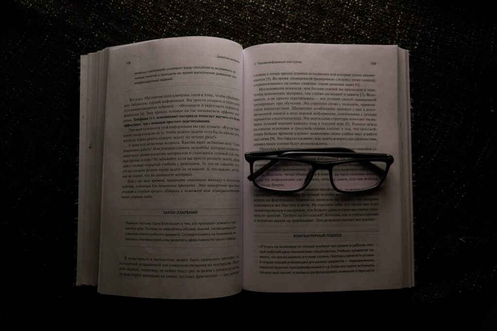 eyeglasses on white book, perhaps show Kidney yin deficiency
