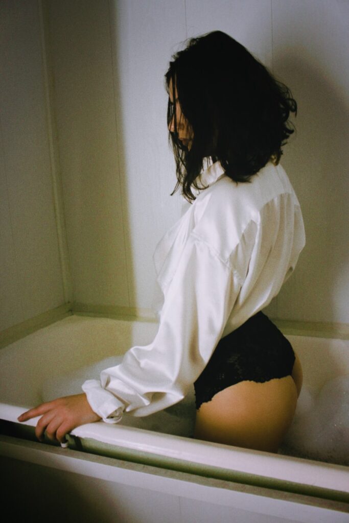 woman in white long sleeve shirt and black panty