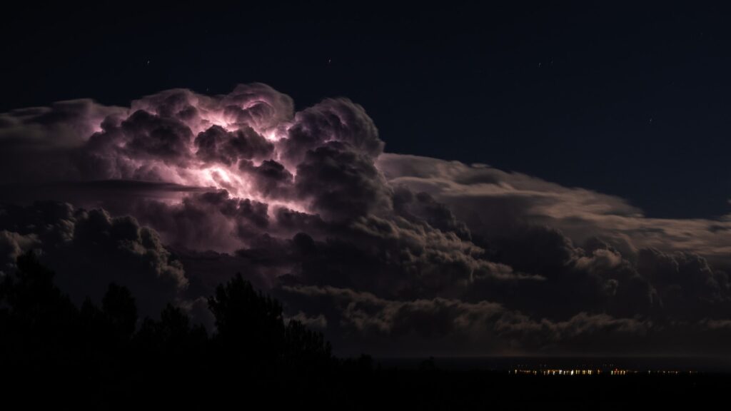 a large cloud with a lightning bolt coming out of it
