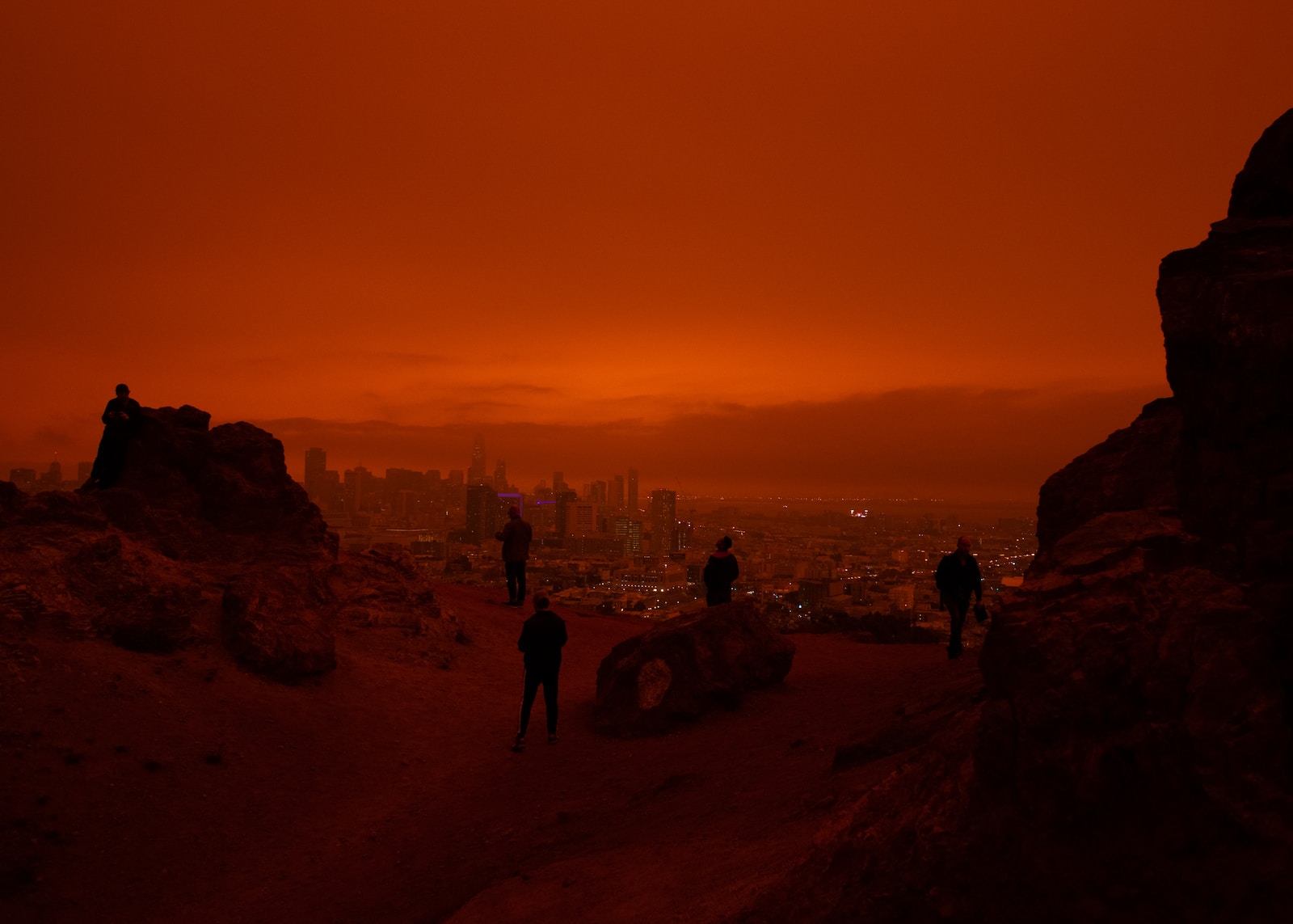 silhouette of people overlooking San Francisco during 2020 fires - collapse of yin