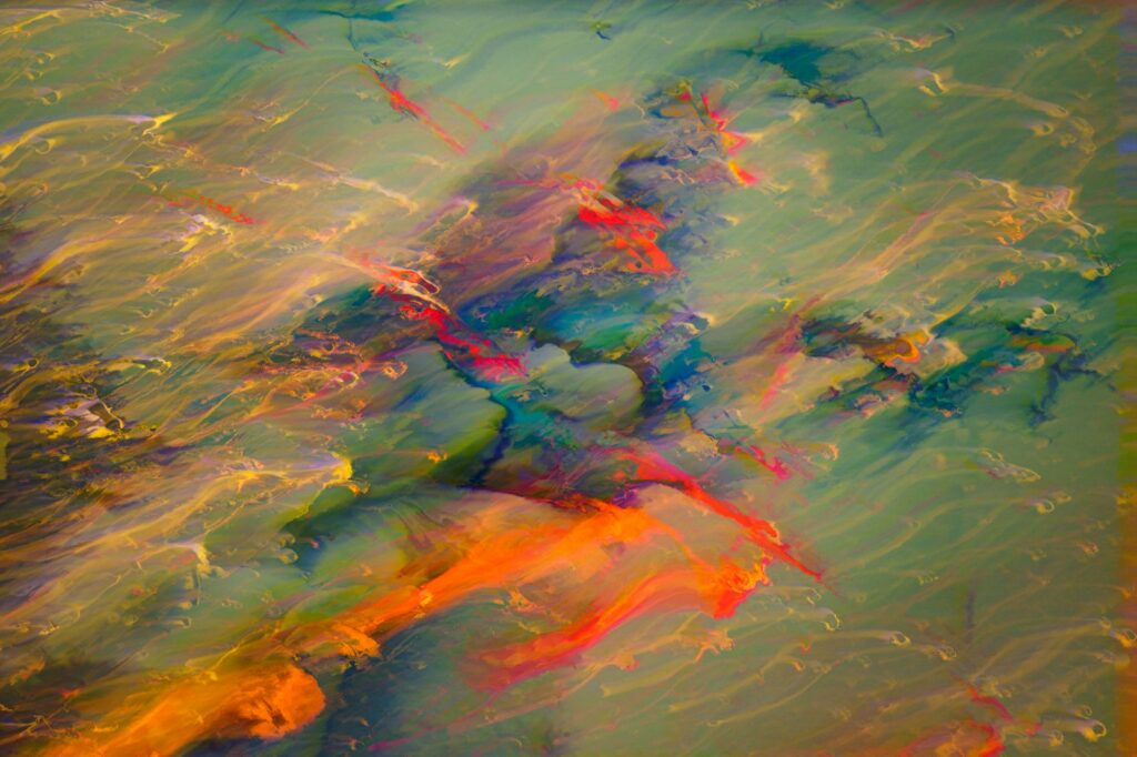 an abstract painting of water and colors